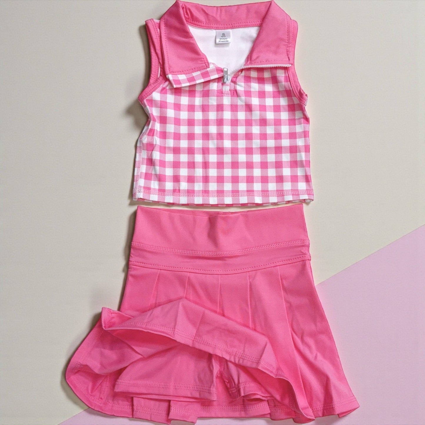 Gingham bubble pink crop top and pleaded skort. High performance athletic outfit
