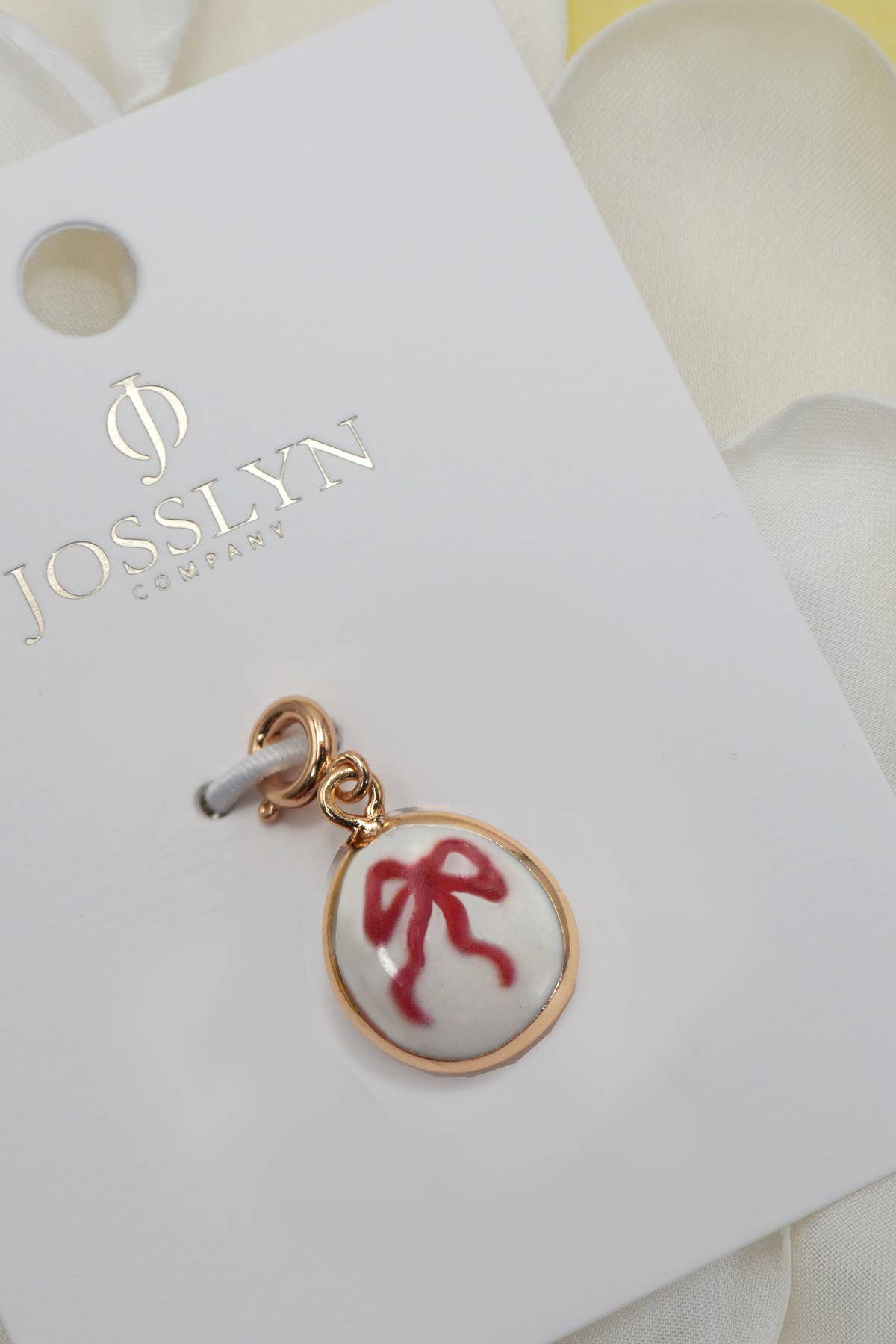 CHARM-PORCELAIN BOW WITH SPRING RING CLASP