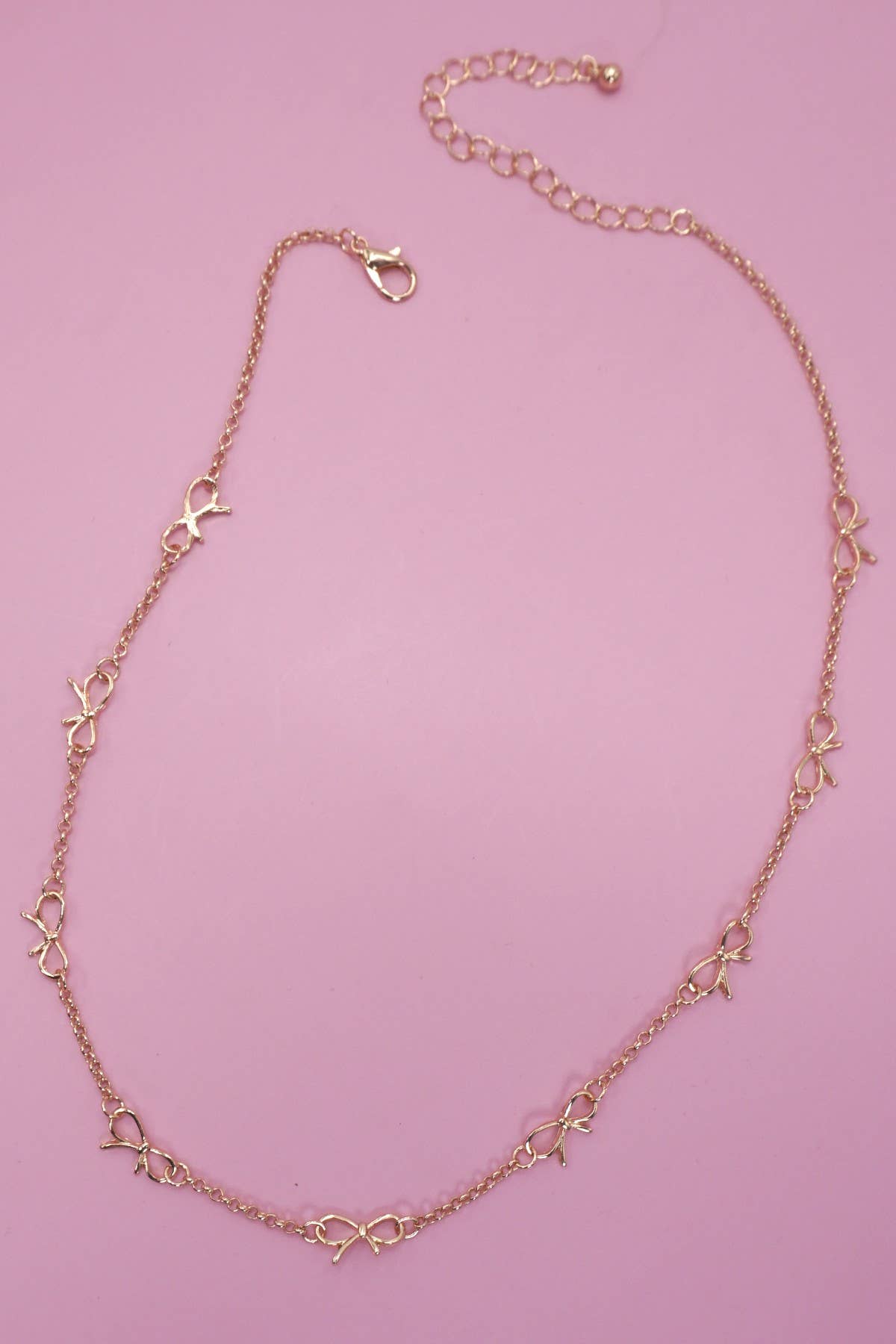 CUTOUT BOW STATION NECKLACE
