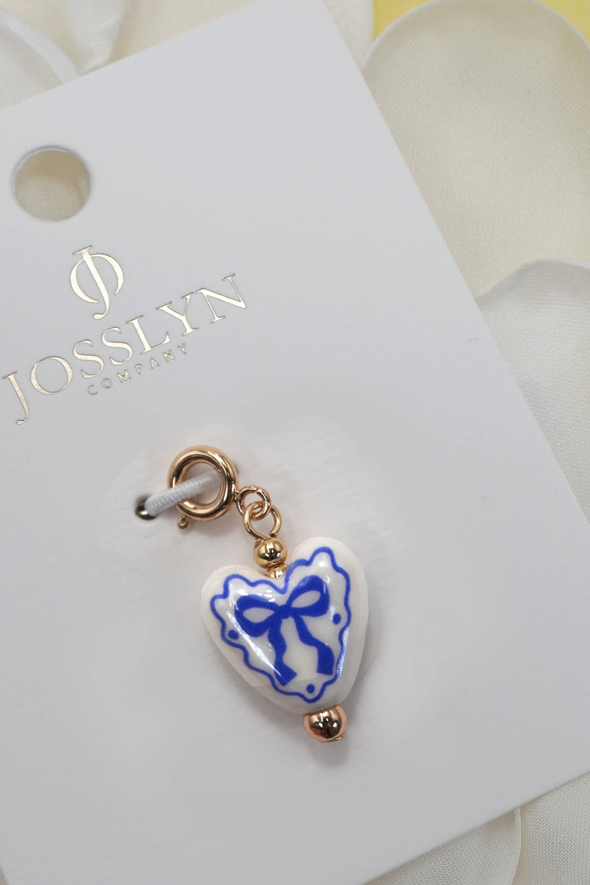 CHARM-PORCELAIN BOW WITH SPRING RING CLASP