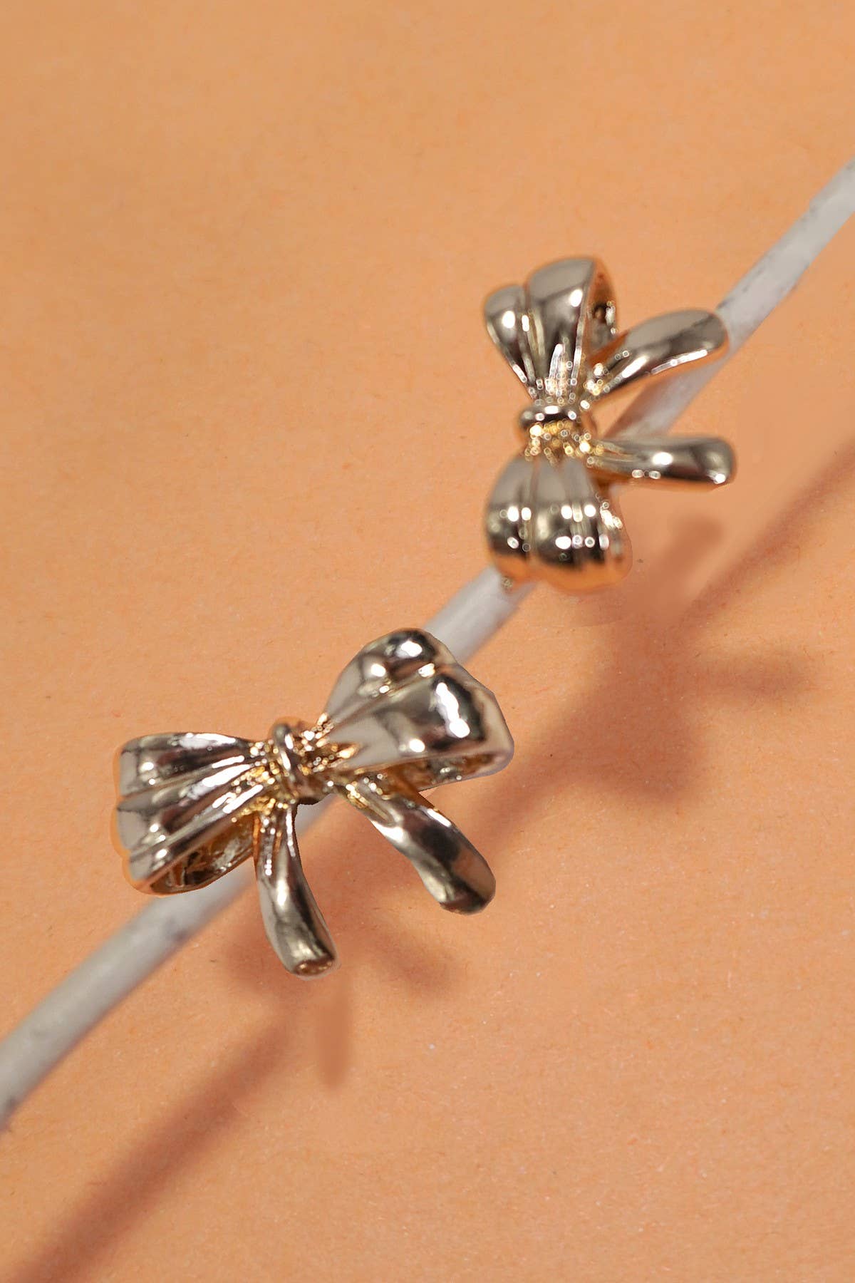 CLASSIC GOLD STATEMENT BOW STUD EARRINGS